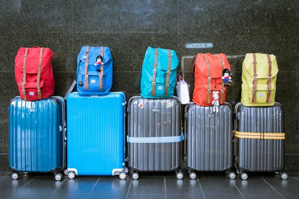 luggage lined up against the wall