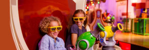 2 girls enjoying the Toy Story ride